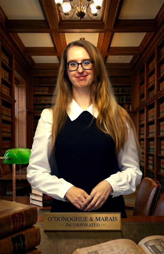 Professional corporate lawyer sitting in the legal library at O'Donoghue & Marais Incorporated, a leading law firm in Springs.